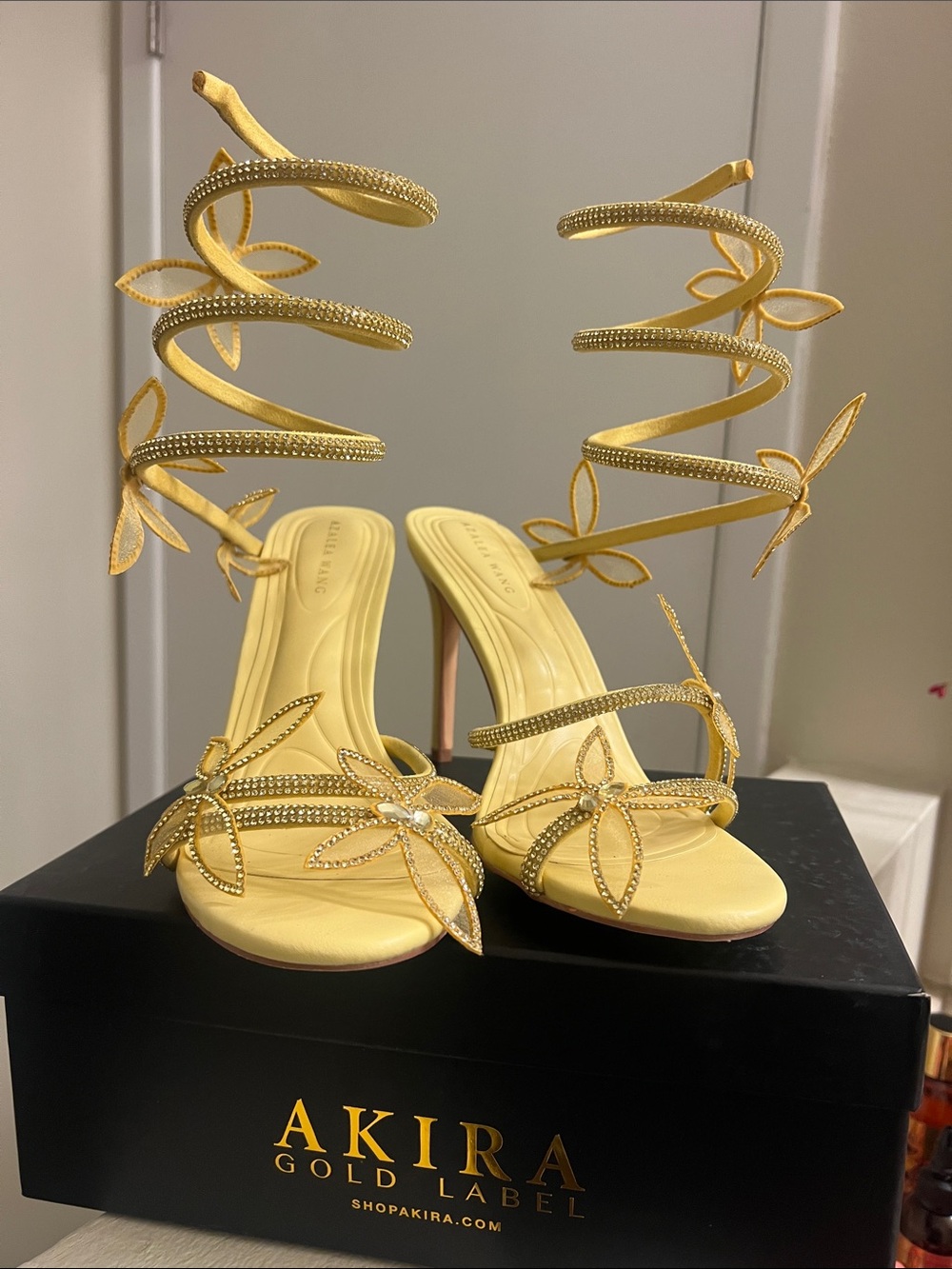 AKIRA Gold-Embellished Yellow Spiral Ankle-Strap Heels